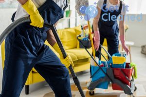 2 End of Tenancy Cleaners in Bromley with a vacuum