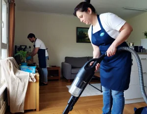 End of tenancy cleaning team in a living room